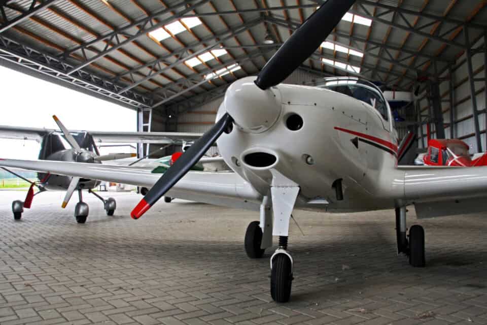small plane parked in a hangar at Plettenberg Bay Airport